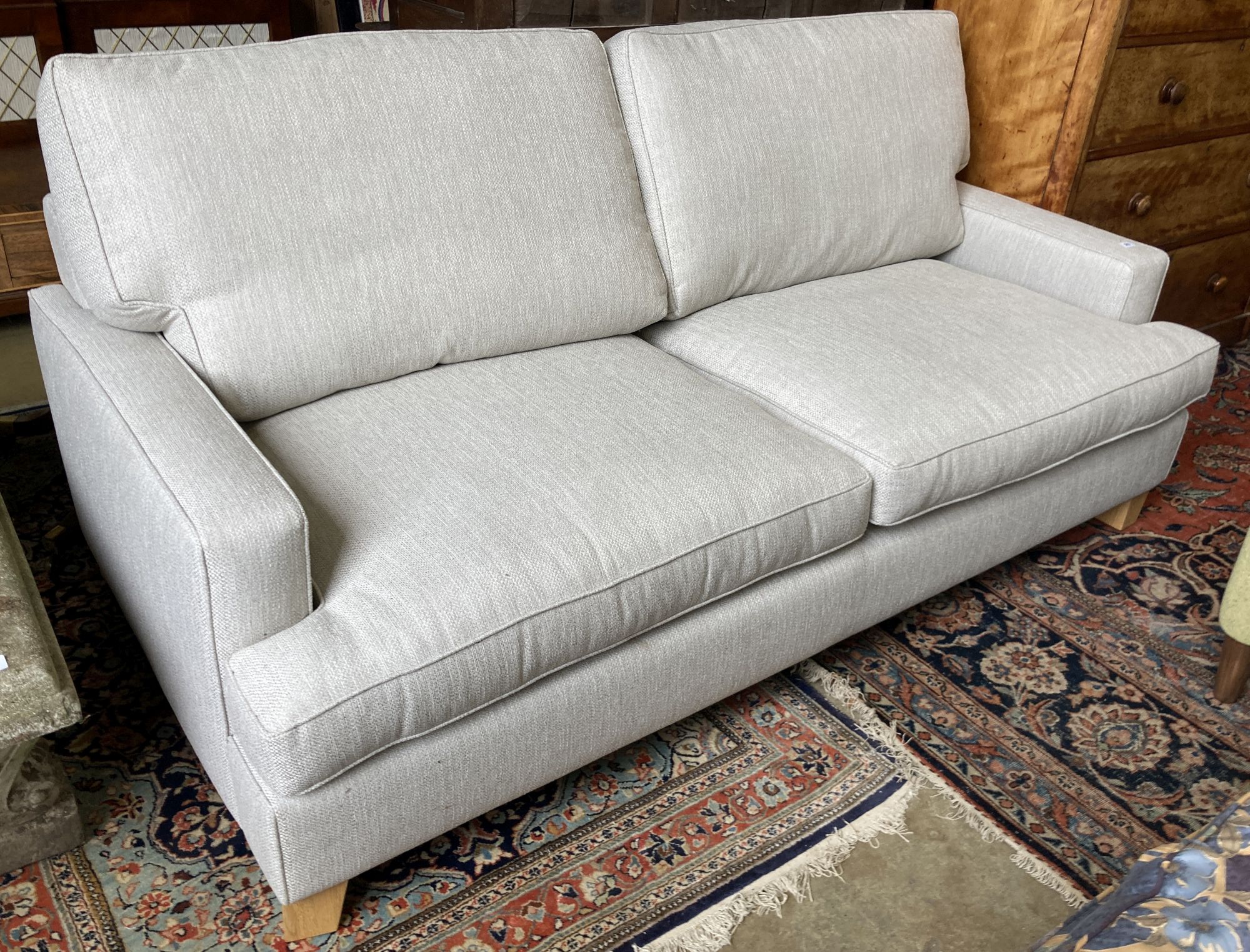 A modern contemporary two-seater sofa, length 206cm, width 102cm, height 98cm